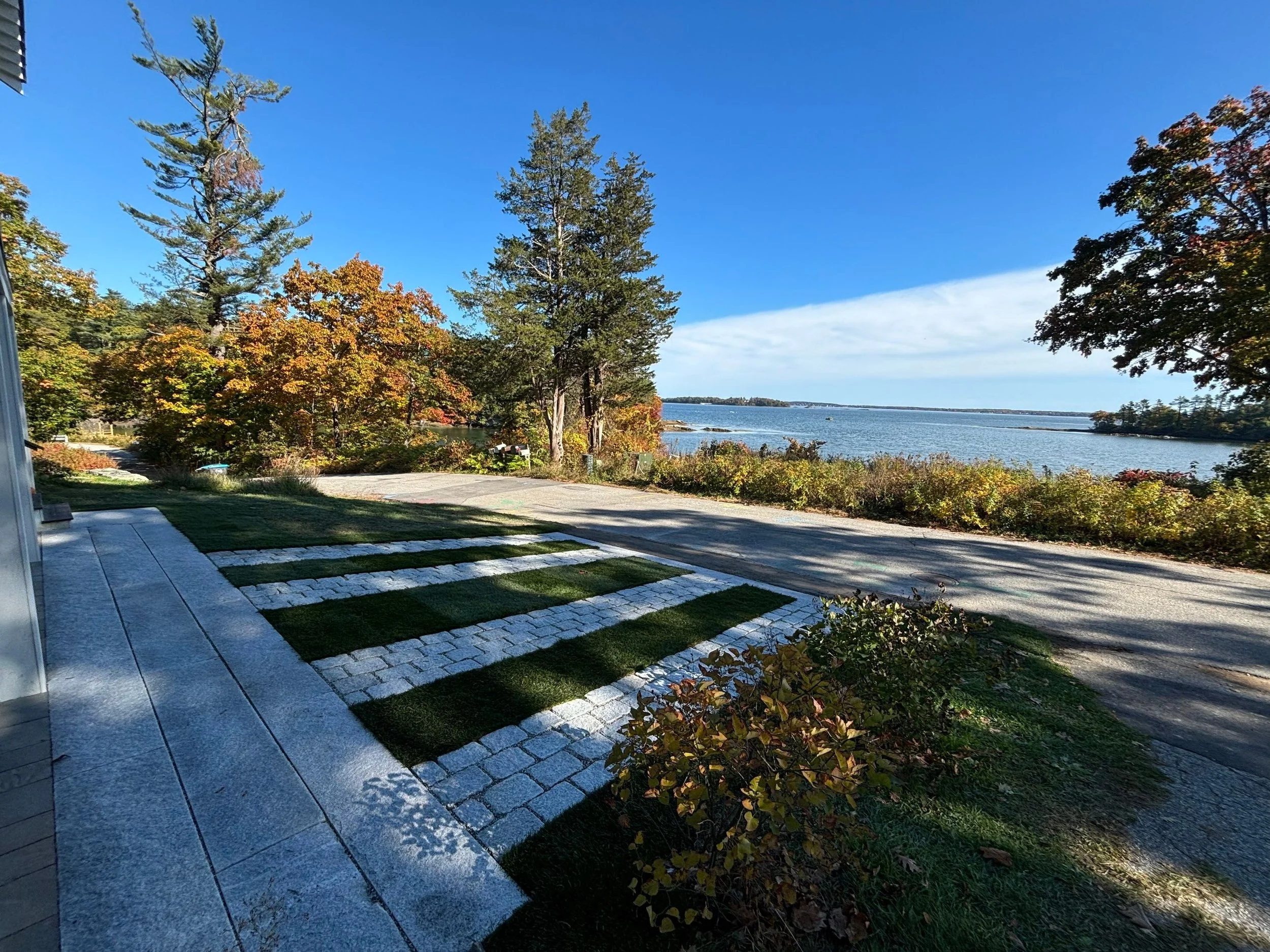 Coastal granite driveway with turf ribbon